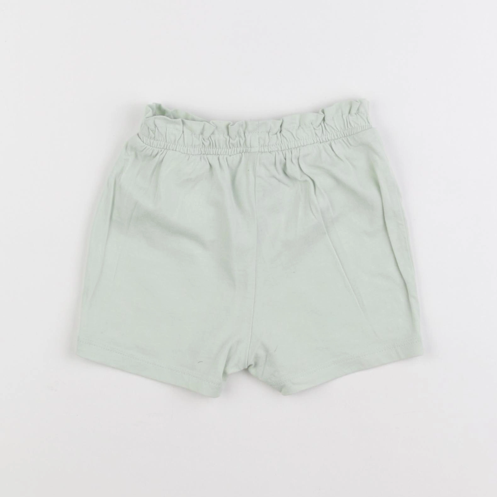 H&M - short vert - 12/18 mois