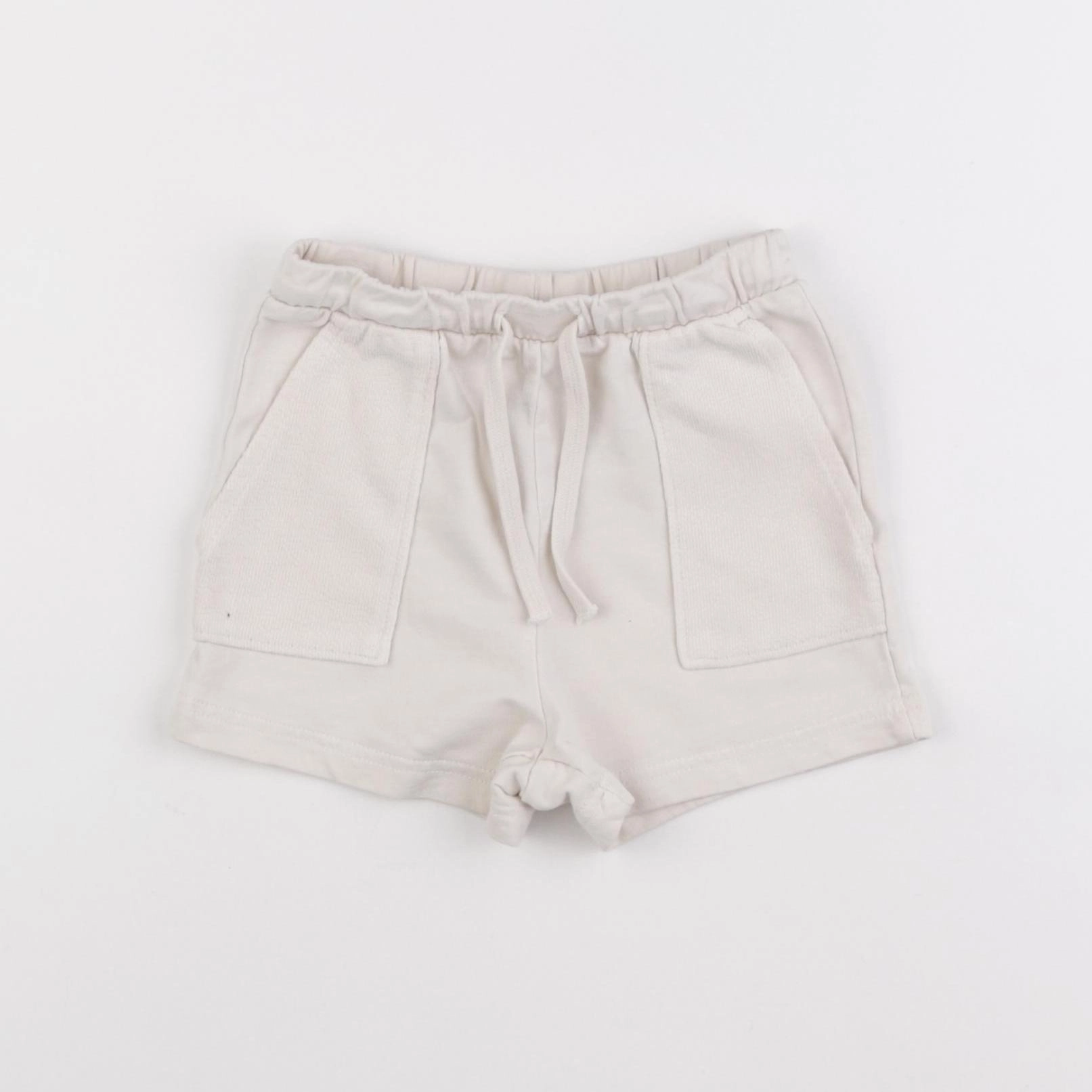 H&M - short beige - 12 mois