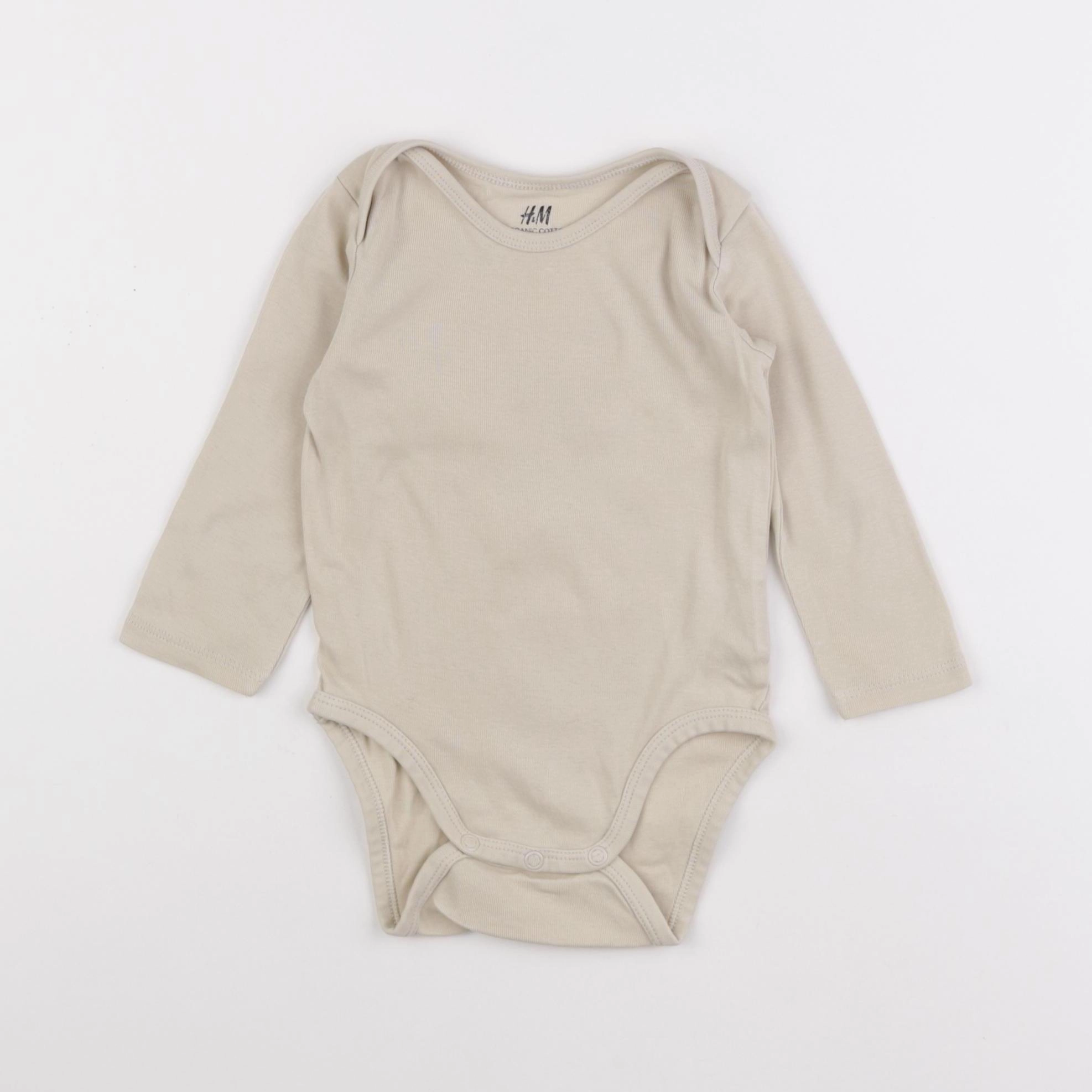 H&M - body beige - 9/12 mois