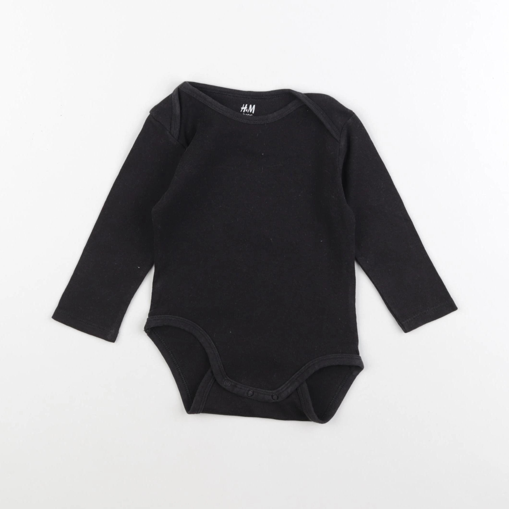 H&M - body noir - 6/9 mois