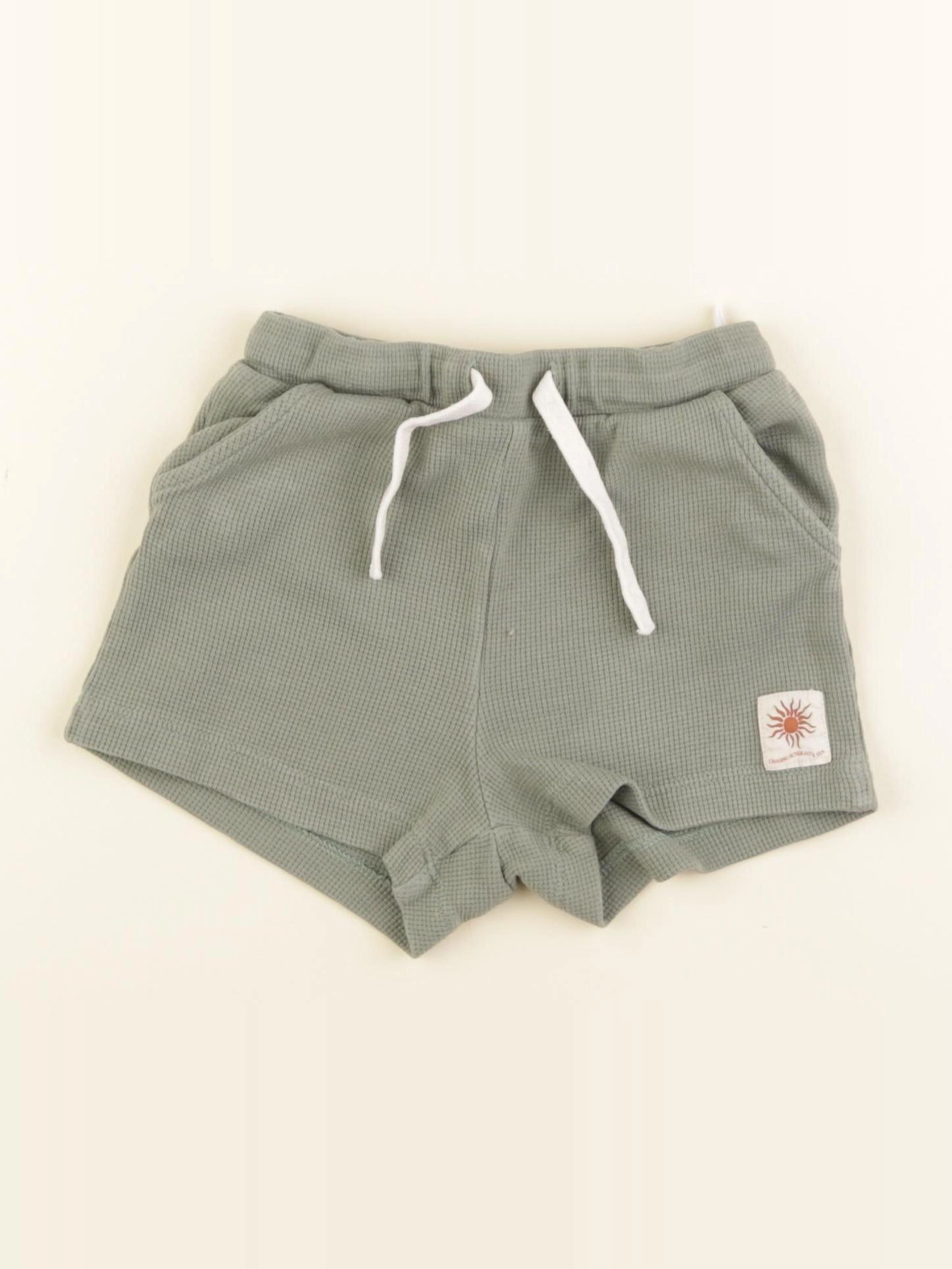 H&M - short vert - 9/12 mois