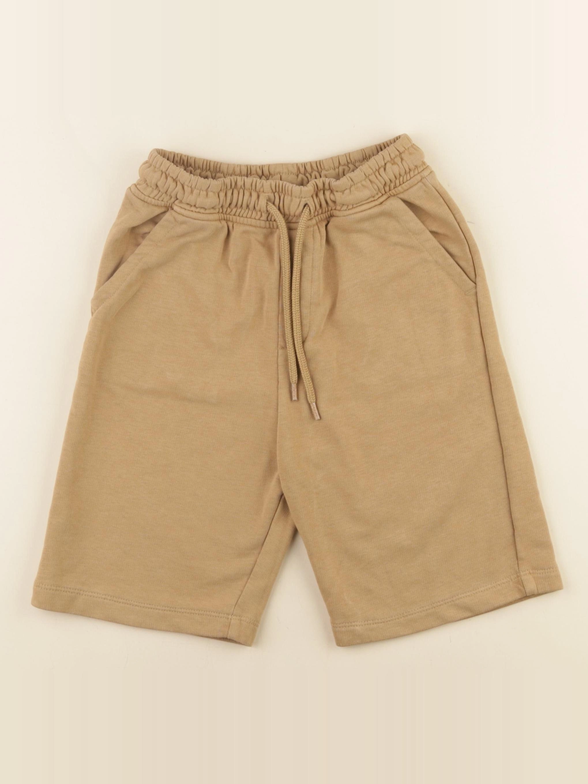 Next - short marron - 9 ans