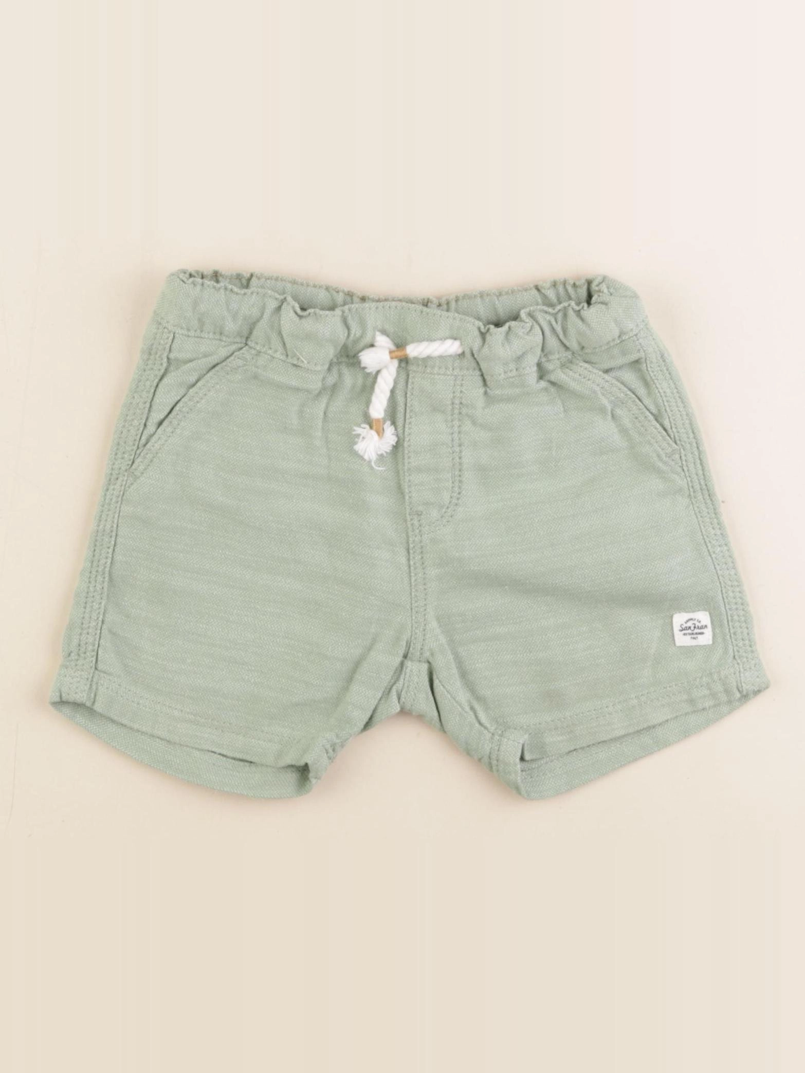 H&M - short vert - 12/18 mois