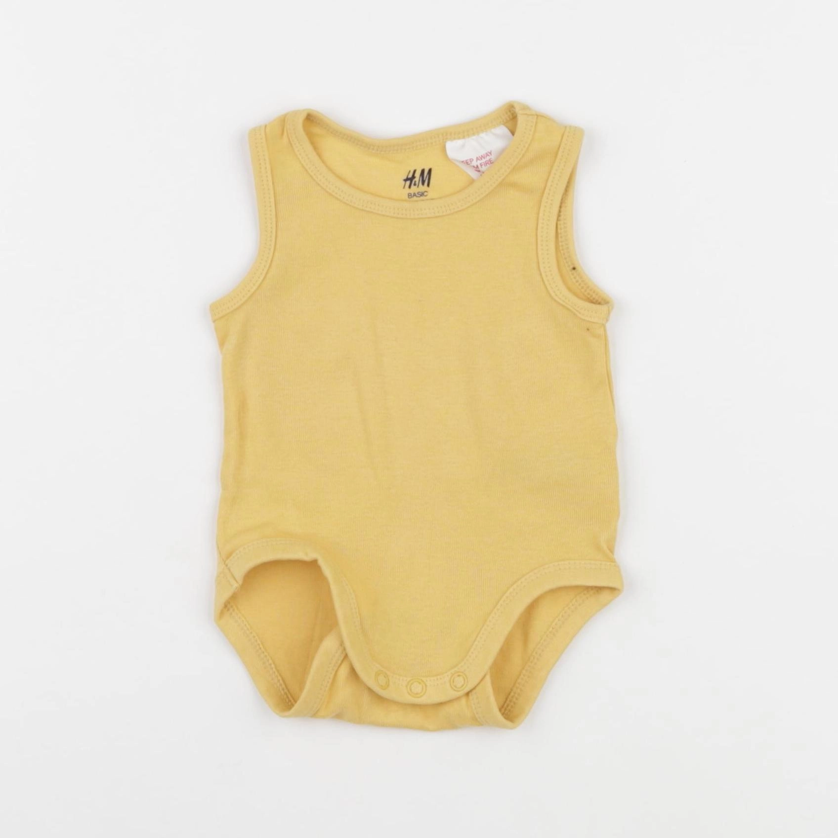 H&M - body coton jaune - 1/3 mois
