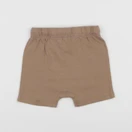 H&M - short beige - 6 mois