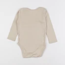 H&M - body beige - 12/18 mois