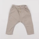 H&M - sarouel beige - 6/9 mois