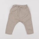 H&M - sarouel beige - 6/9 mois