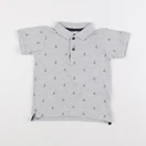 H&M - polo gris - 12/18 mois