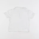 Zara - polo blanc - 12/18 mois