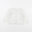 H&M - gilet blanc - 6/9 mois