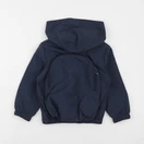 Tape à l'oeil - coupe-vent/ sac à dos bleu - 3 ans